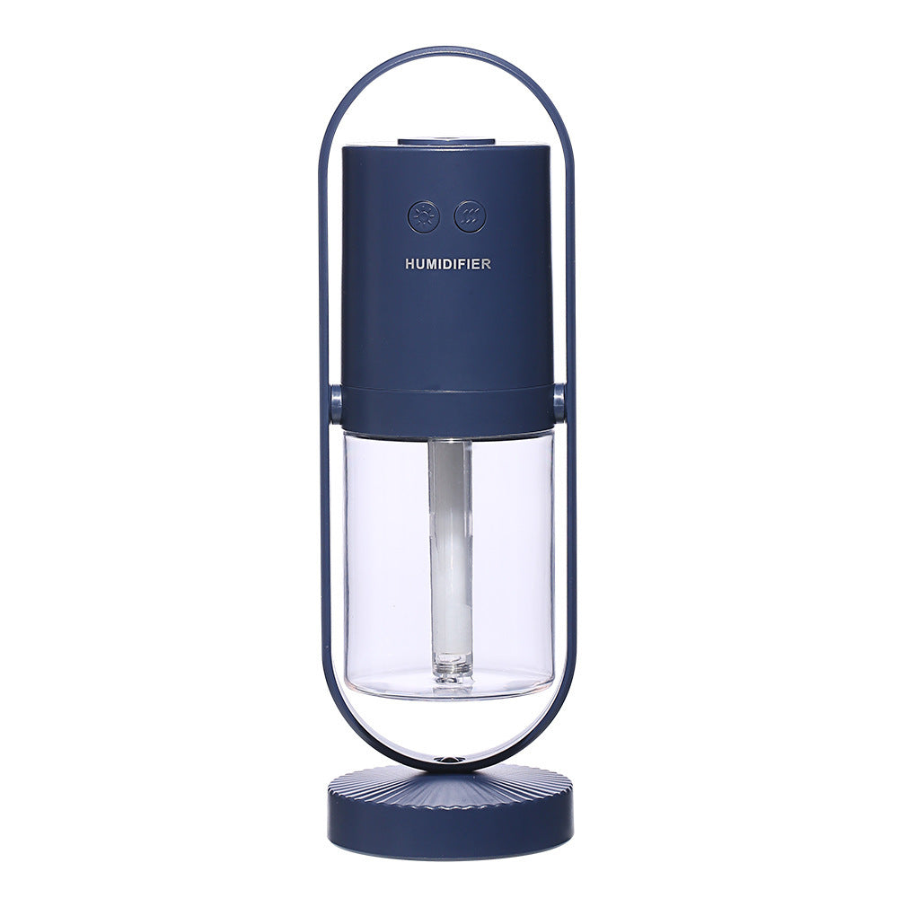 Dark blue cylindrical USB air humidifier with clear water tank and oval frame stand.