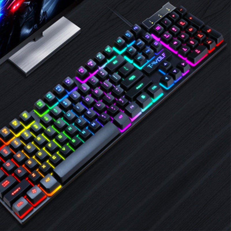 Black wired gaming keyboard with RGB backlit keys and floating keycaps on a dark surface.