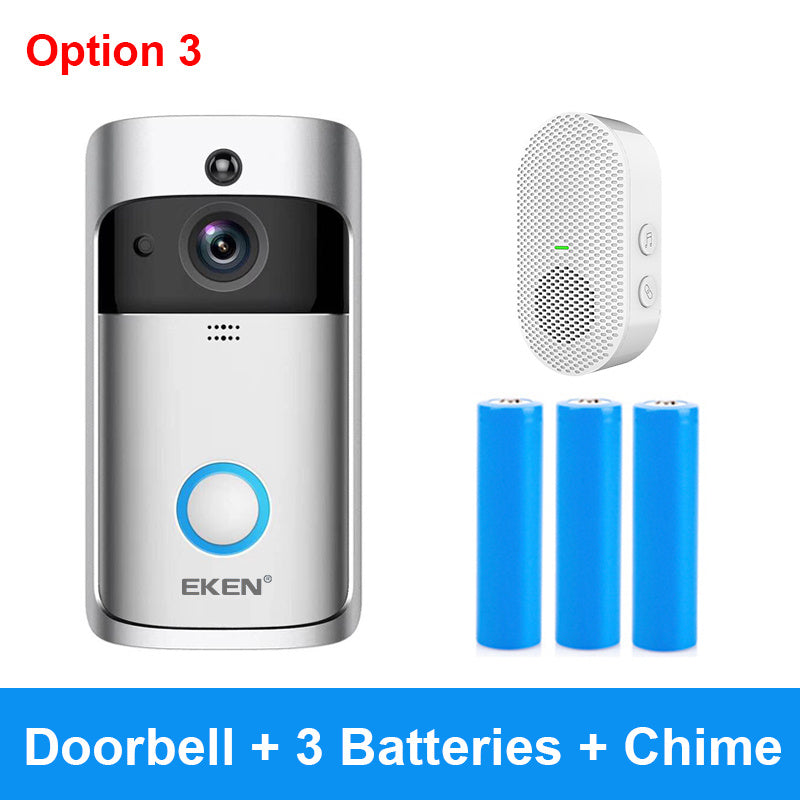 Silver and black smart doorbell with camera, blue ring button, white chime, and three blue batteries.