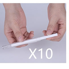 Ten white cotton swabs for Magic Shadow USB air humidifier held by hands against light background.