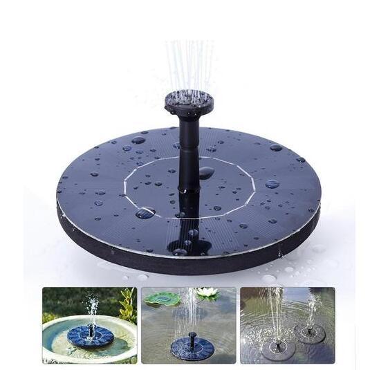 Black circular solar-powered floating fountain with central spout spraying water upward.