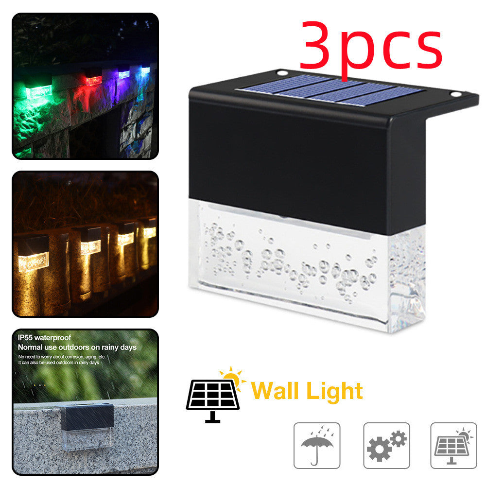 Black waterproof solar step fence light with RGB LED and textured diffuser panel.