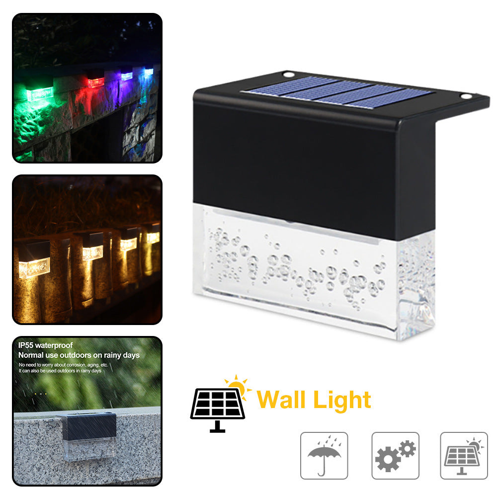 Black waterproof solar step light with RGB LED and textured clear bottom panel.