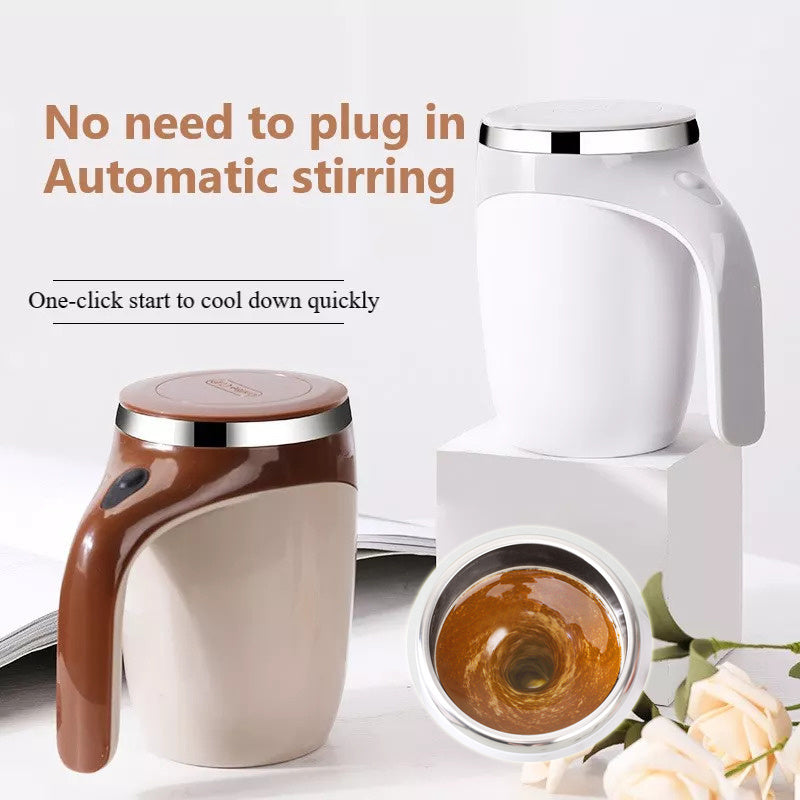 Brown and beige electric automatic stirring cup with handle and silver rim, shown with coffee inside and one cup tipped over .